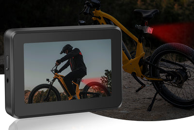 4.3-inch monitor showing cyclist on yellow fat tire ebike with rearview camera.