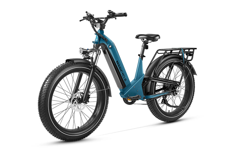 Teal Magicycle Deer step-thru electric bike with fat tires and rear cargo rack for outdoor adventures.