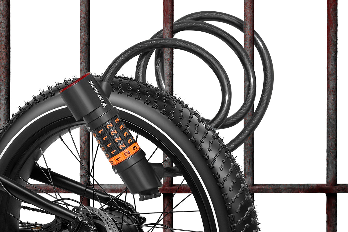 WestBiking bike lock with combination code wrapped around tire near a metal fence