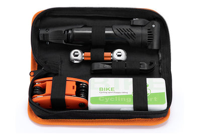 Compact bicycle repair set with pump, multi-function tool, and tire levers in a case