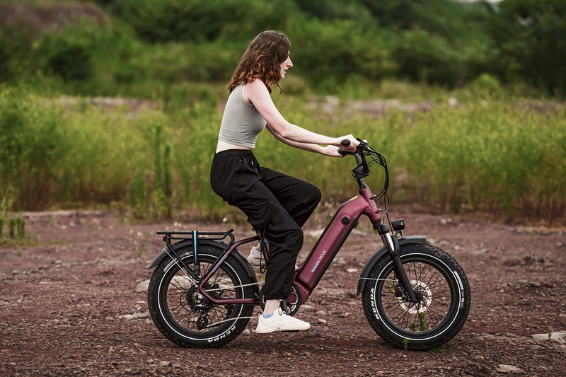 Rider enjoying Magicycle Ocelot Pro 2.0 electric bike in outdoor terrain