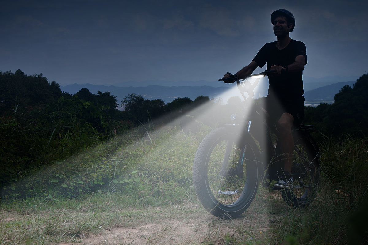 Rider using Super Bright LED Electric Bike Light on an electric bike outdoors at dusk