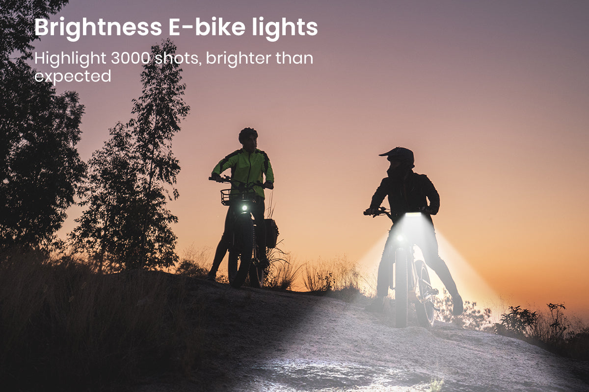 Two cyclists with bright lights riding at dusk, highlighting visibility and adventure.